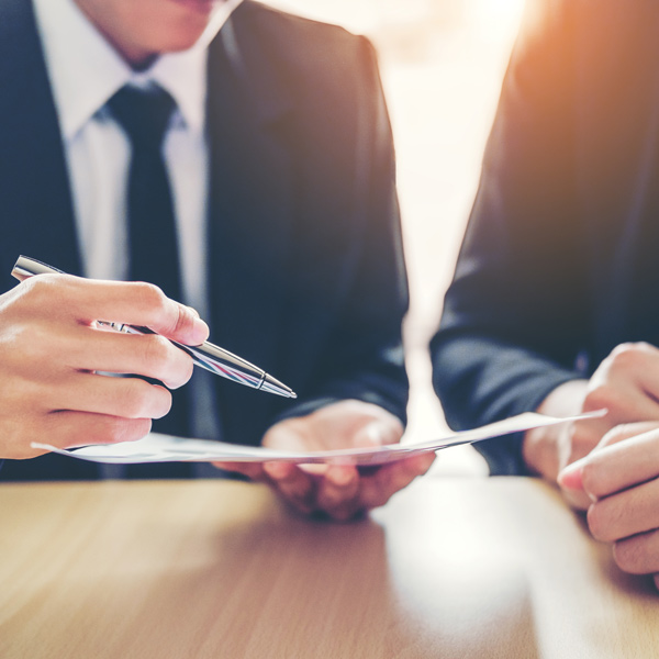 business professionals reviewing paperwork